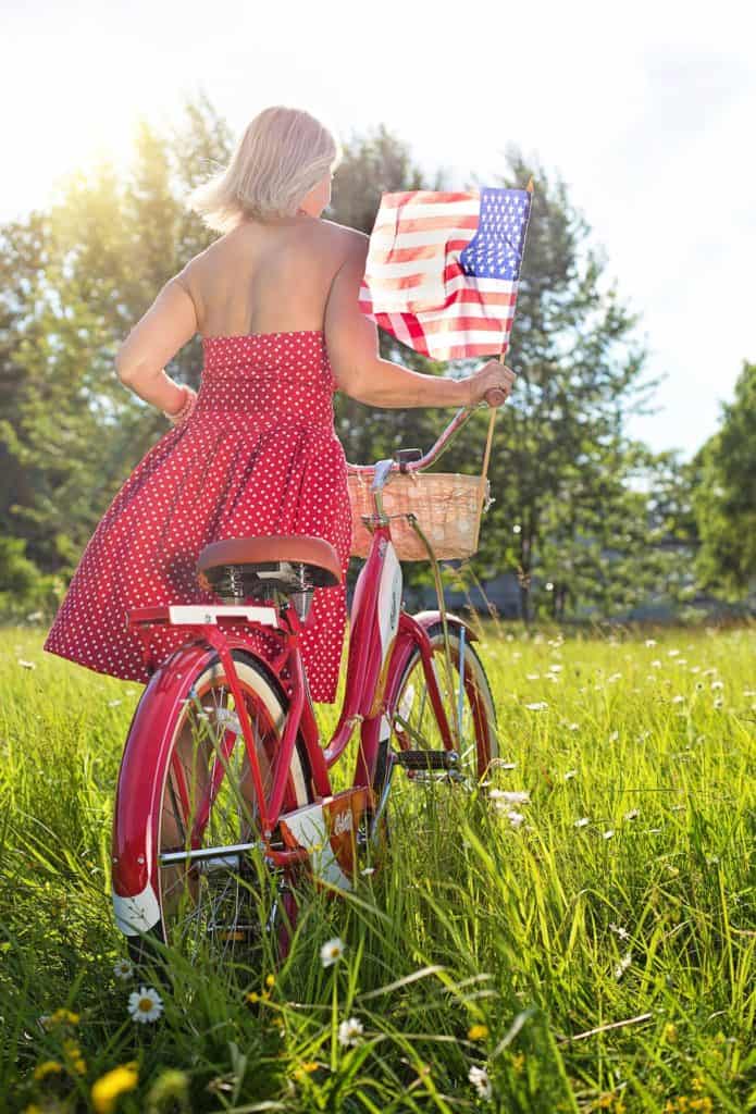 woman with bike 3498612 1920 1