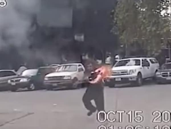 Seattle man catches police car on fire
