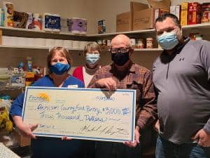 Bev McConaughey, FCCU Atchison Branch Manager, proudly presented $3,000 to The Atchinson County Food Pantry team. (L to R): Bev McConaughey (FCCU Atchison Branch Manager), Lois Reed (Pantry Asst. Director), David Gatewood (Pantry Director), Brad Greene (P