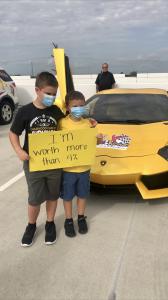 JJ lost both eyes to Retinoblastoma Cancer and continues to bring Hope to all children battling cancer. His sign says I'm worth more than 4% because our government only allocates 4% of NCI funds for Childhood Cancer Research. All our kids are worth more t