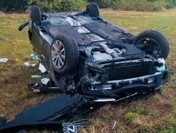 V-1 was traveling northbound on I-75 and exited to the westbound entrance ramp to SR-618 when the driver failed to negotiate the curve in the roadway. V-1 departed the roadway and overturned, during which time the passenger was ejected from the vehicle and suffered fatal injuries. The driver was partially ejected from the vehicle, suffered serious injuries, and was transported to an area hospital.