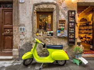 748826 vespa in front of italian shop 300x225 1