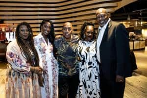 Miami Lakes Mayor Rodney Harris, right, and family meet soul singer Jeffrey Osborne at Embrace Benefit concert.