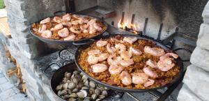 Traditional Spanish influenced foods like this paella be cooked on an asado grill can be found on the tables of restaurants throughout Florida's Historic Coast.