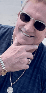 Creator Rob Samson raises funds for Jewish nonprofits and Israel.  Shown here wearing Samson Jewelry for Israel chain, Shema pendant, and Sports Star Weightlifting Bracelet and ring.