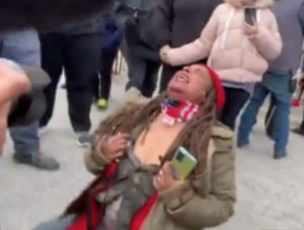 “Fuck America” a woman says before having a seizure on the Kenosha Courthouse steps