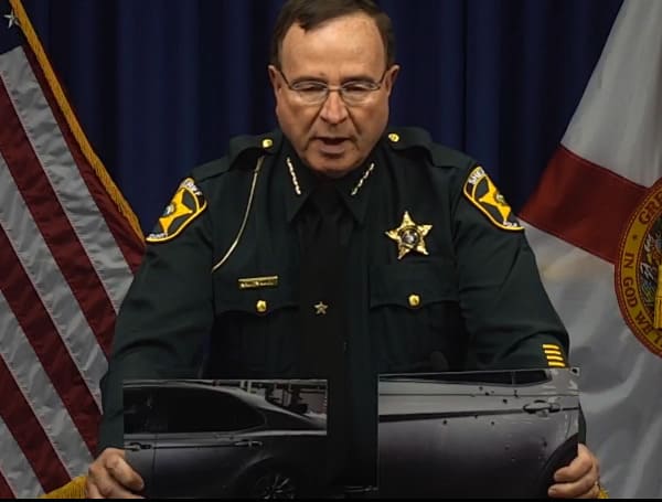 Polk County Sheriff Grady Judd, "Some of these bullets are entrance holes into this vehicle. Some are exit holes from the vehicle."