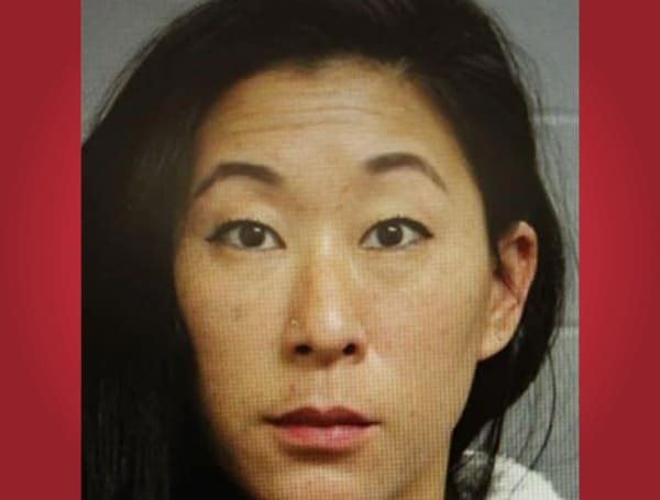 A Connecticut woman, who is also a teacher at Waterbury Public Schools, is accused of leaving her two children home alone over a November weekend so she could vacation with her boyfriend in Florida.