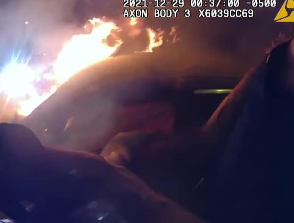 In this dramatic video, released by Pasco Sheriff's Office, you will witness deputies literally tearing a car apart with their arms to get a woman out of the burning vehicle.