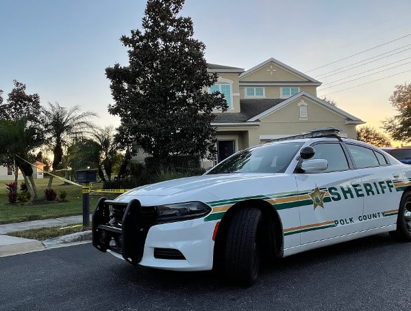The Polk County Sheriff's Office is investigating a deputy-involved shooting in unincorporated Davenport this afternoon. Preliminary information is as follows: around 3:00 p.m. on Sunday, January 23, 2022, deputies assigned to the Northeast District responded to Oakcrest Court in the Providence subdivision after the PCSO ECC received a 911 call from an elderly woman who reported her adult son was trying to smother her. She said she woke up to the suspect repeatedly pressing a pillow on her face when she was napping on the couch. She was able to escape from the house and call from a safe location.