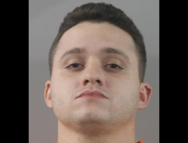 While talking to the driver, 22-year-old Jalynn Guinn, LPD Officers observed another vehicle pull into an adjacent parking lot, and the Hispanic male driver, later identified as 27-year-old Michael Gonzalez-Lauzan of Lakeland, approached.