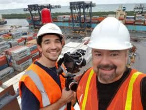 Chip Carter and a crew member atop a gantry crane at Port Everglades, where imported fruits and vegetables are being unloaded