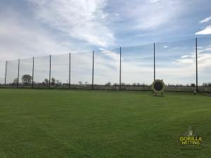 The newly replaced driving range netting system featuring a much cleaner look with the new netting and down guy replacements.