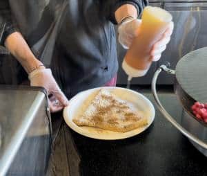 A delicious crepe is in the making at iCafe de Paris as part of the Flavors of ICON Park  Foodie Walking Tour