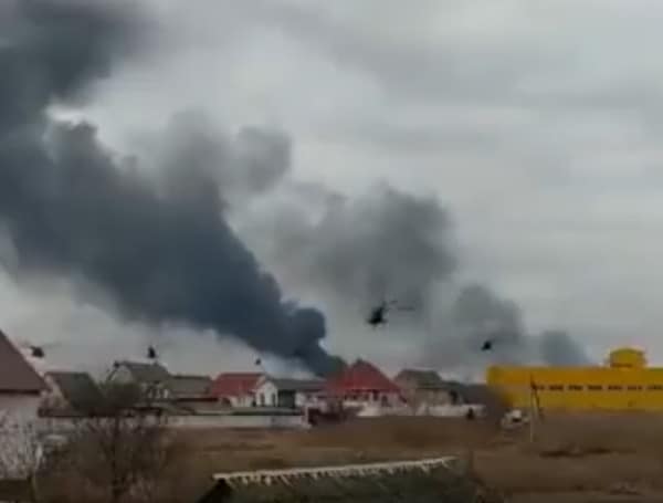 Russian helicopter gunships swept over Ukraine to attack an airport just miles from Kyiv.