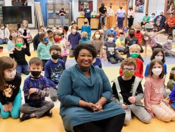 There was something surprising about a photo of the still-unelected “governor” of Georgia, Stacey Abrams, appearing at a Decatur, Georgia, elementary school.