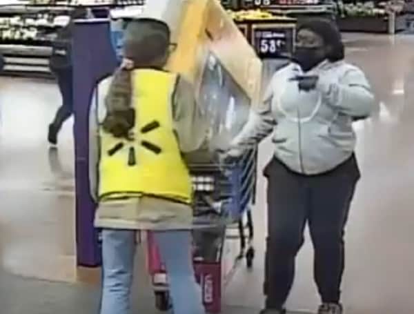 A Florida woman is sought by police after walking into a Walmart and walking out with big-screen TVs, a soundbar, and telling employees to help her "load it up".