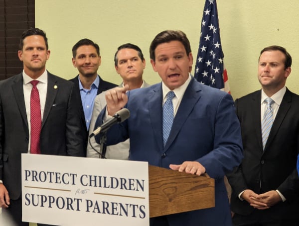 LGBTQ-advocacy groups and federal education officials Monday condemned Gov. Ron DeSantis for signing a bill that will bar instruction about sexual orientation and gender identity in early school grades, with one organization pledging to file a lawsuit