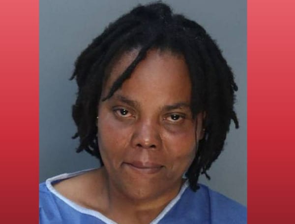 A 41-year-old Florida woman has been arrested in the deaths of her two children, ages 3 and 5, after officers responded to repeated hang-up 911 calls from her apartment where they found their tied-up bodies.