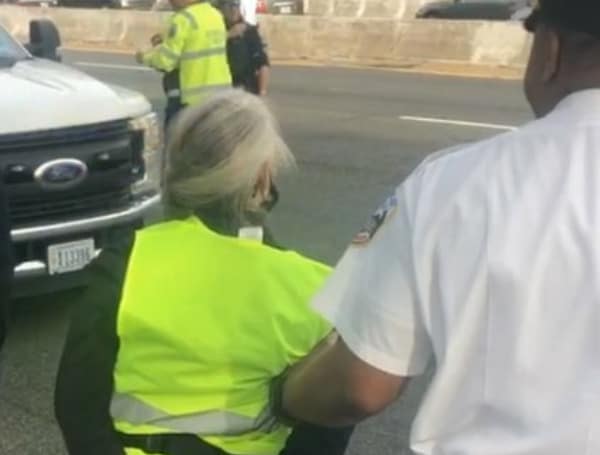 Climate activists are blocking I-395 in Washington DC. Arrests currently in progress.