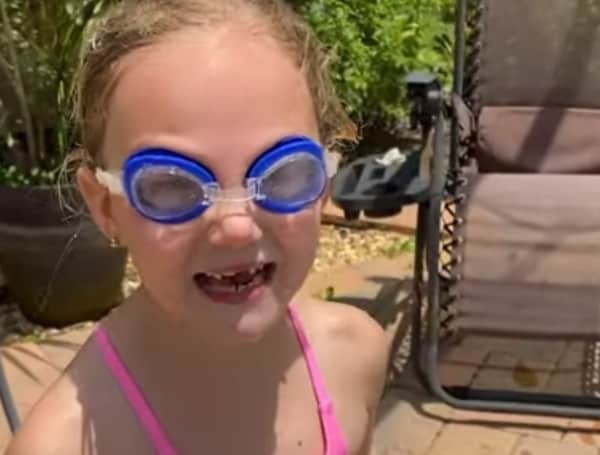 It's getting hot today, and Fallyn had one of her friends over and decided to have a splash contest in the pool.