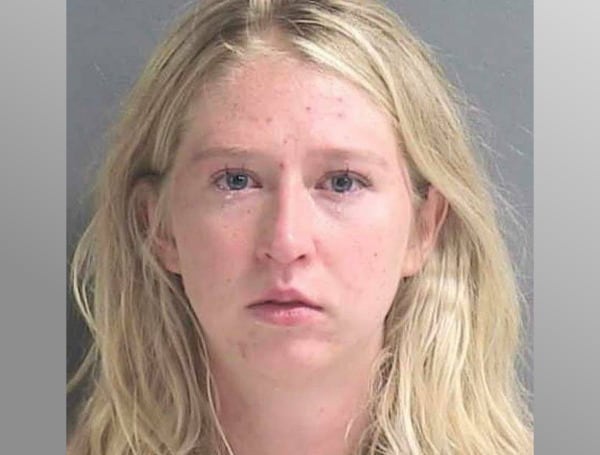 A Florida woman has been arrested after leaving four dogs in her vehicle, while she had lunch.