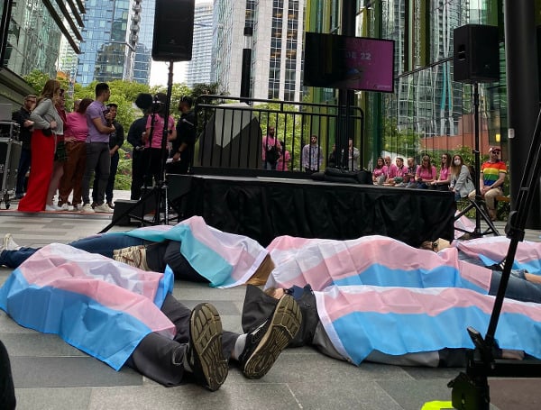 Amazon employees protested the sale of books they consider “anti-trans” by staging a “die-in” protest in front of the company’s Seattle headquarters, disrupting a corporate Pride Month event, The Washington Post reported.