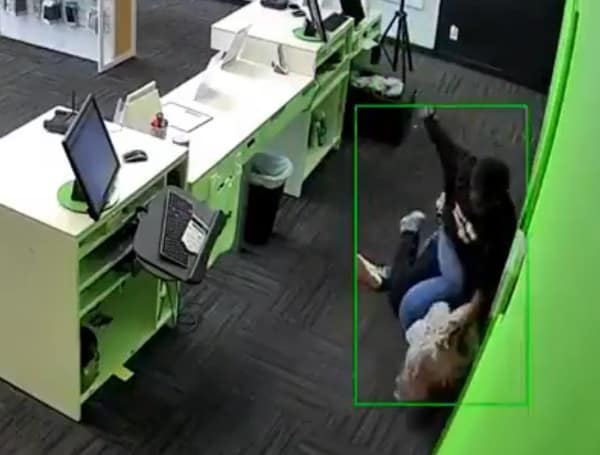Police arrested a suspect Wednesday in the brutal beating of a female mobile phone store employee that was caught on video.