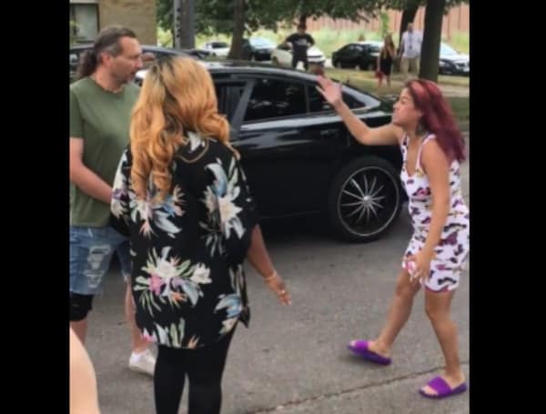 A woman confronted protesters outside her home Saturday after Minneapolis police fatally shot a man who had fired into her apartment while her children were inside, according to KARE 11 News.