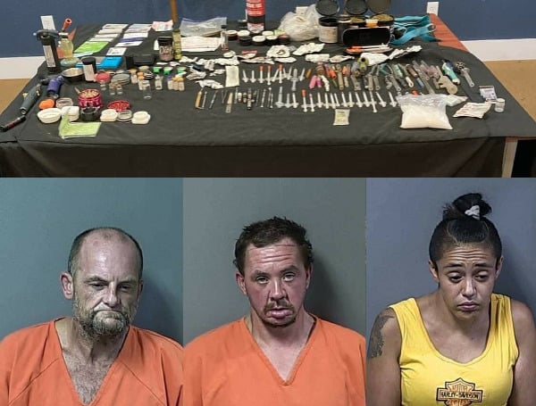 A trio of Colorado residents has been arrested after a traffic stop uncovered a stolen vehicle and a table full of dope. 