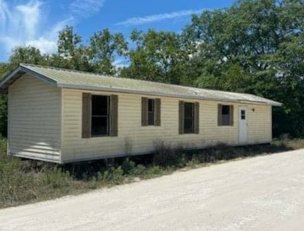 The pictured mobile home, a 48-foot single wide, was left by a moving company at 11171 NE 71 Street between Bronson and Williston in Levy County.