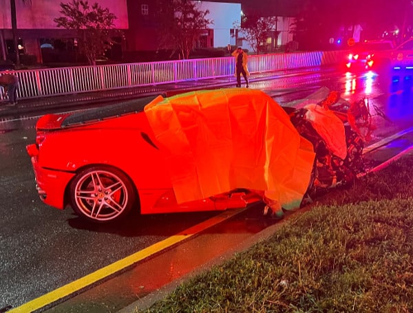 Two people died after driving their Ferrari head-on into another car on Sunday night.