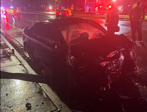 Two people died after driving their Ferrari head-on into another car on Sunday night.