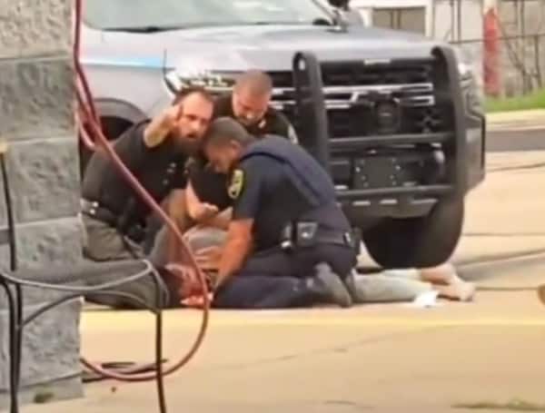Three law enforcement officers are in hot water after a viral video of them beating a man was released on social media.