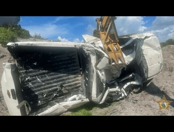 A Florida man crushed a victim’s truck with an excavator after battering her over her lack of being able to get money for drugs, according to deputies.