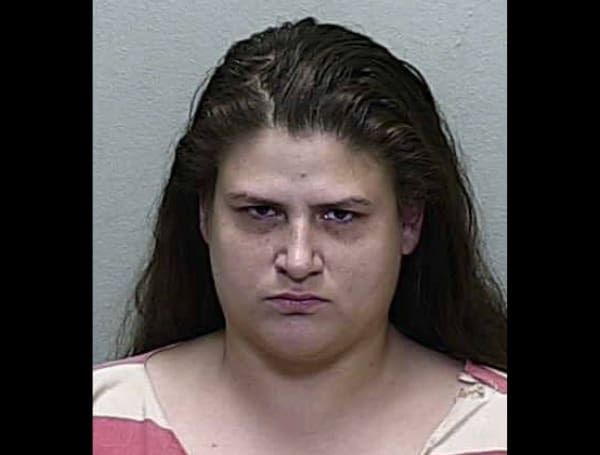 A Florida woman has been arrested after deputies say she stabbed her roommates and then went shopping after she thought they were dead.