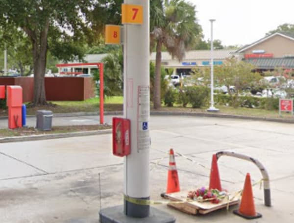 An injured Circle K employee who attempted to save the life of a customer engulfed in flames at a gas pump has filed suit in the Pinellas County courts. 