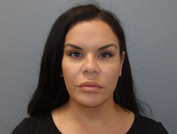 A 41-year-old Florida woman was arrested Wednesday for doing nearly $200,000 in unlicensed contract work in the Upper Keys.