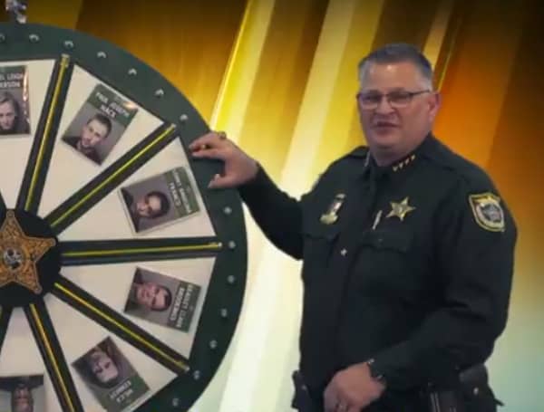 A Florida man has filed a defamation lawsuit against a Florida sheriff who posts weekly “Wheel of Fugitive” videos on social media.