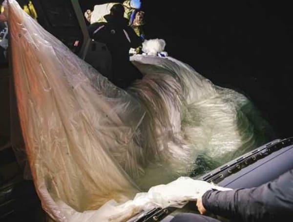 A photo from the U.S. Navy shows sailors assigned to Explosive Ordnance Disposal Group 2 recovering a high-altitude surveillance balloon off the coast of Myrtle Beach, South Carolina.