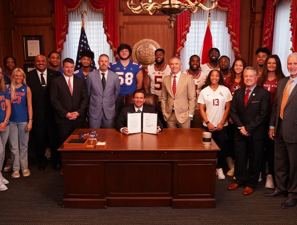 Gov. Ron DeSantis on Thursday signed a measure that will allow Florida colleges and universities to help steer endorsement deals toward student-athletes. 