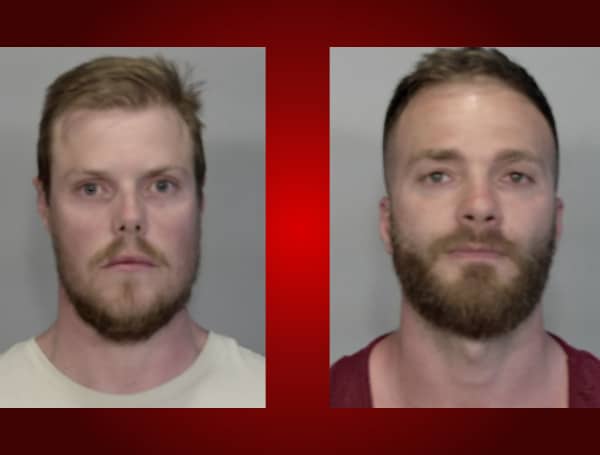 Two men were arrested Tuesday after breaking into an impound yard and leaving with a car that had been previously towed.
