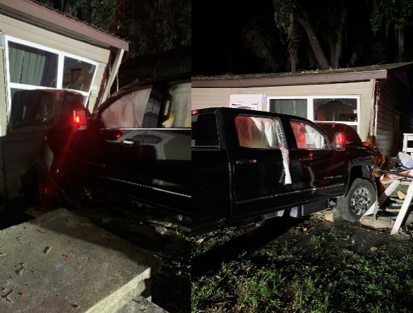 A 20-year-old Florida man has been charged with careless driving after failing to stop at a stop sign and crashing into a home, injuring two people.