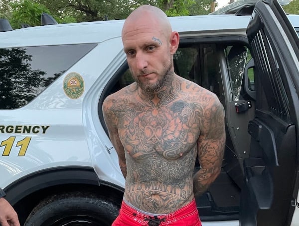 A Florida man wanted for lewd and lascivious battery on a child under 16 was arrested after trying to use a makeshift hideout under a home in DeFuniak Springs to escape.