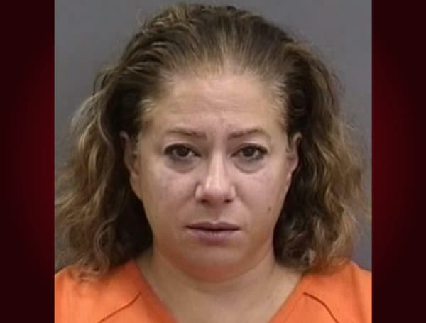 TAMPA, Fla. - A local principal turned herself in following an investigation involving her failure to report child abuse.