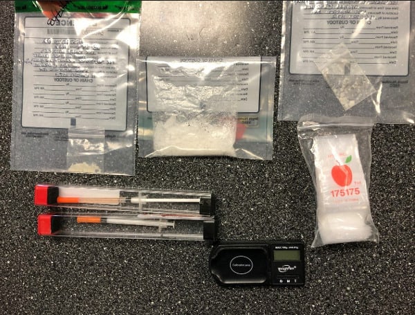 A Florida man has been arrested after choosing a random house to charge his cell phone and subsequently being charged with drug trafficking.