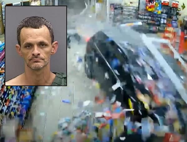 TAMPA, Fla. - A Florida man is facing charges for driving through a gas station and pinning a victim walking into the store.