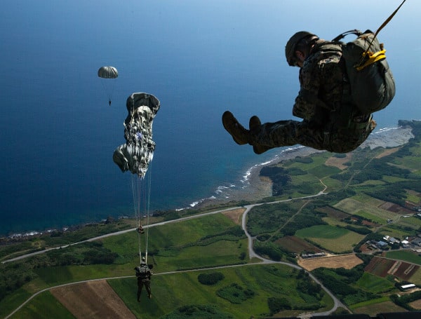U.S. Marines jump from a KC-130J Super Hercules during parachute drills over Okinawa, Japan. The training sustains operational readiness while ensuring Marines are prepared to rapidly insert into austere environments through multiple methods. (Department of Defense)