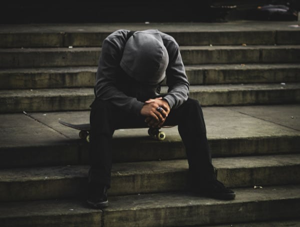 Skateboarder With His Head Down (Unsplash)