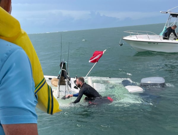 Talk about being in the right place at the right time. Five men aboard a sinking center console boat near the Old Seven Mile Bridge in the FLorida Keys were rescued Thursday after Monroe County Sheriff Rick Ramsay spotted them from U.S. 1.
